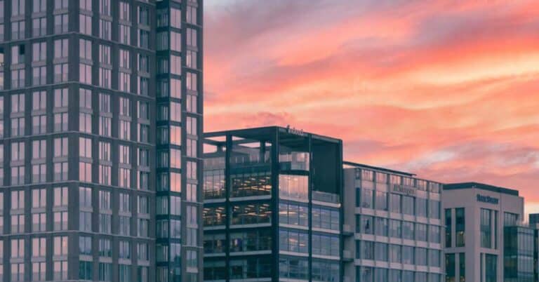 Office buildings with a sunset backdrop.