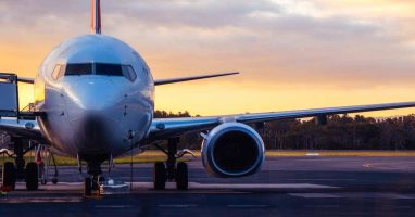 Jet airplane view with sunset backdrop